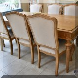 F29. Universal Furniture oak dining table with additional leaf and 6 chairs. Table: 31”h x 78”w x 39”d